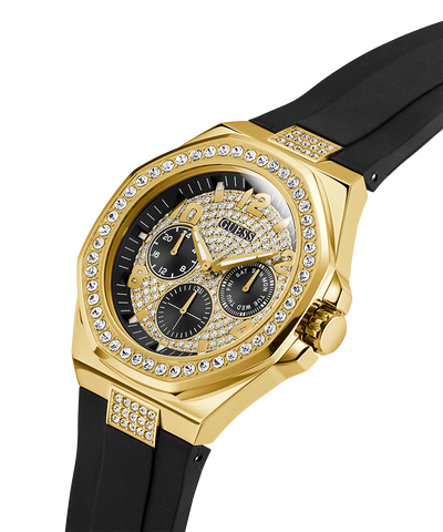 GUESS Mens BLACK GOLD TONE Analog Watch with gold case, black strap, and diamond-studded face on a white background lifestyle