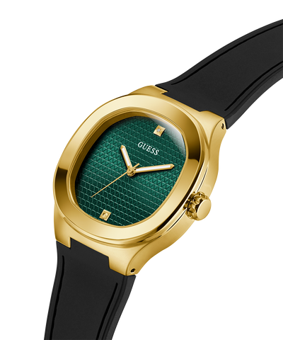 Gold watch with green face and black strap on white background lifestyle