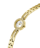 Gold watch with a white face on a white background lifestyle