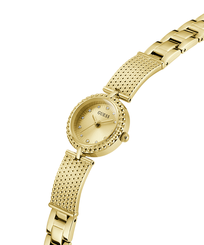 Gold watch with a textured band on a white background lifestyle