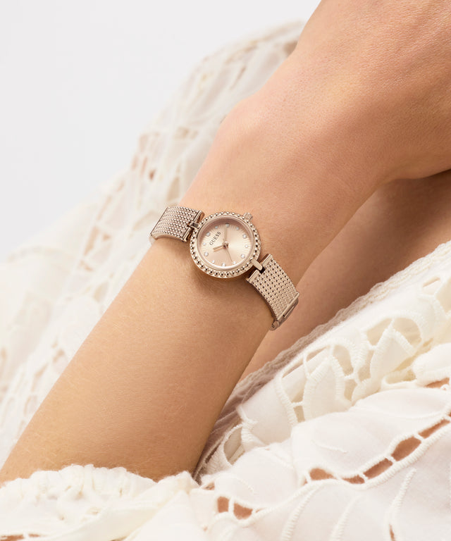 GUESS Ladies Rose Gold Tone Analog Watch on womans wrist