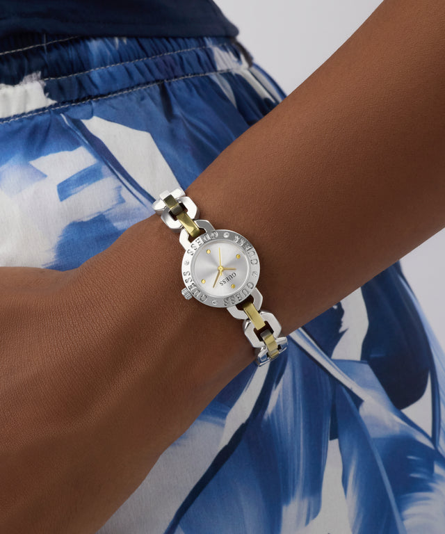 Watch on a wrist with a blue and white patterned garment in the background GW1019L3