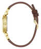 A side profile view of a watch with a gold-tone case and a brown leather strap, isolated on a white background.