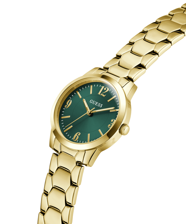 Gold watch with a green dial on a white background lifestyle