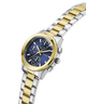 Two-tone gold and silver watch with a blue dial on a white background lifestyle