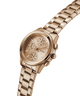 Rose gold GUESS Ladies Birdie Rose Gold Tone Analog Watch with a detailed face on a white background lifestyle