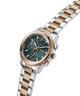 GUESS Ladies Birdie 2-Tone Analog Watch with silver and rose gold band on a white background lifestyle