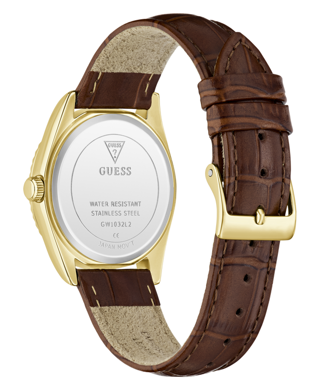 The back view of a GUESS wristwatch with a brown leather strap, gold-tone case, and white back cover showing the brand name and specifications.