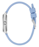 Light blue GUESS Ladies Blue Silver Tone Analog Watch strap with silver clasp on a clear background