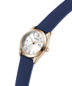 GUESS Ladies Blue Rose Gold Tone Analog Watch with blue strap and gold case on a white background lifestyle