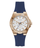 Guess watch with rose gold case, blue rubber strap, and white dial on a transparent background