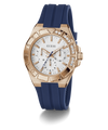 Guess watch with rose gold case, white dial, and blue strap on a transparent background