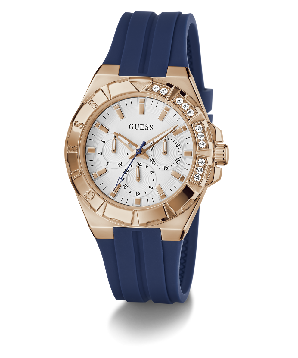 Guess watch with rose gold case, white dial, and blue strap on a transparent background