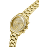 Gold watch with diamond-studded face on a white background lifestyle
