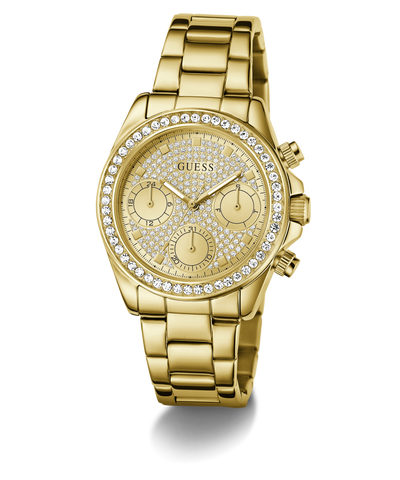 GUESS Ladies Victoria Gold Tone Multi-Function Watch with diamond-studded face on a white background