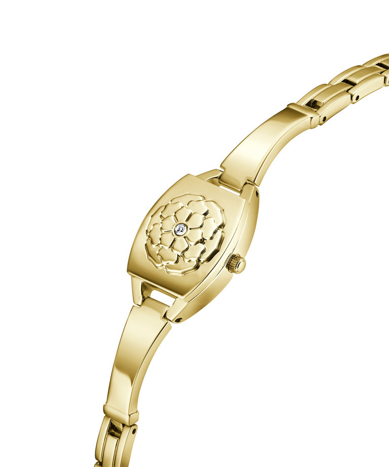 Gold wristwatch with intricate design on a white background lifestyle