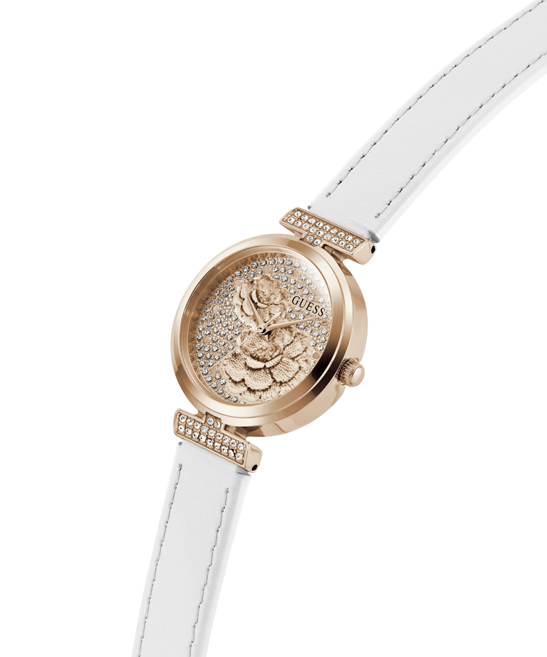 Rose gold watch with white strap on a white background lifestyle