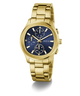 Gold GUESS Mens Palmer Gold Tone Analog Watch with a blue face on a white background