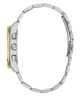 Close-up of a silver watch with a gold accent on a white background