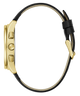Gold watch case with black leather strap on a white background