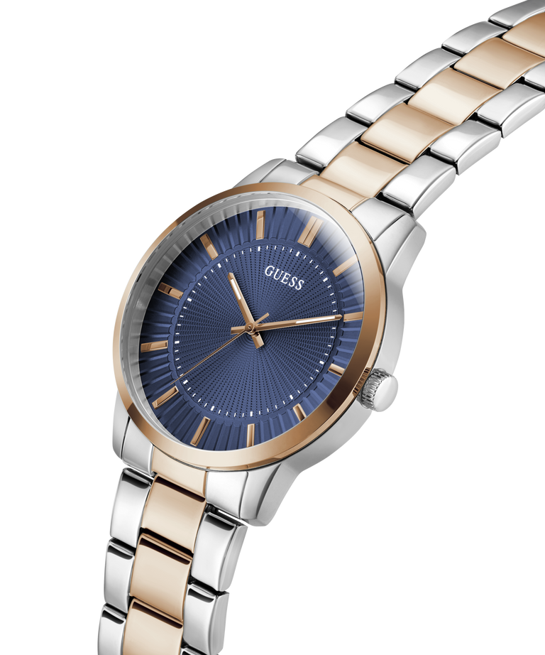 Guess watch with silver and rose gold band on a white background lifestyle