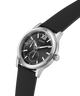 Black watch with silver case and black strap on a white background lifestyle
