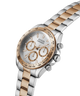 Two-tone GUESS Mens Arthur 2-Tone Analog Watch with silver and rose gold band on a white background lifestyle