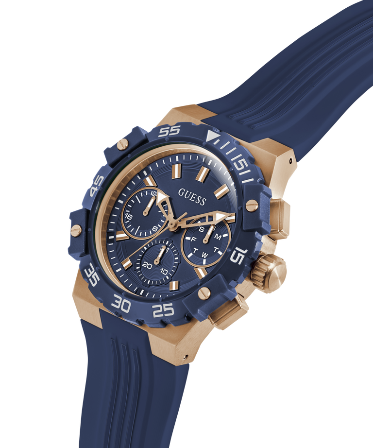 Blue and gold GUESS Mens Midnight Blue Rose Gold Tone Analog Watch with visible brand logo on a transparent background lifestyle