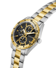 Two-tone silver and gold watch with black dial on a white background lifestyle