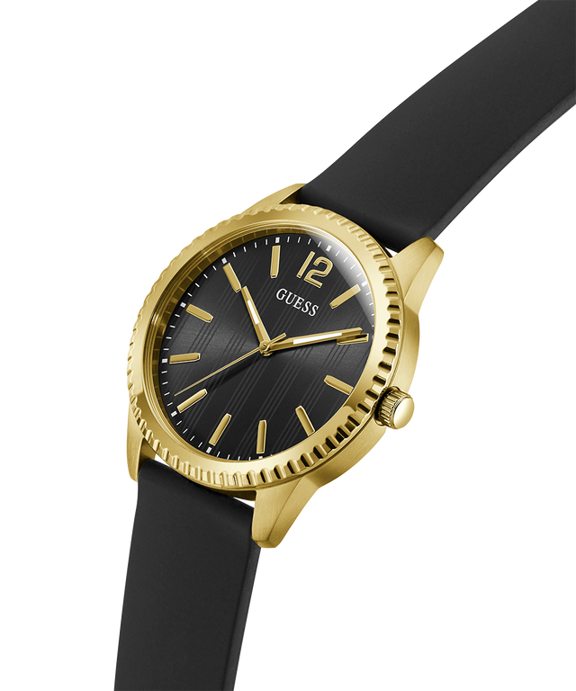 Gold and black watch with 'Guess' branding on a white background lifestyle