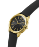 Gold and black watch with 'Guess' branding on a white background lifestyle