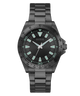 Black Guess watch with green accents on a white background