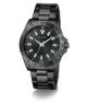 Black Guess watch with green accents on a white background