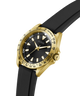 Gold and black watch with a black strap on a white background lifestyle