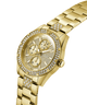 Gold watch with diamond-studded face on a white background lifestyle