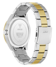 Close-up of a Guess watch with a two-tone metal band on a white background