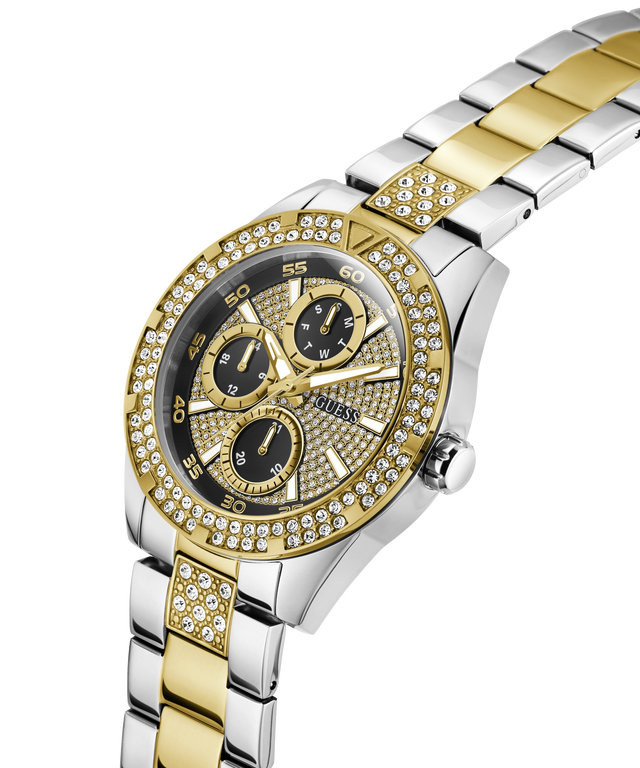 GUESS watch with gold and silver band on a white background lifestyle