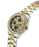 GUESS watch with gold and silver band on a white background lifestyle
