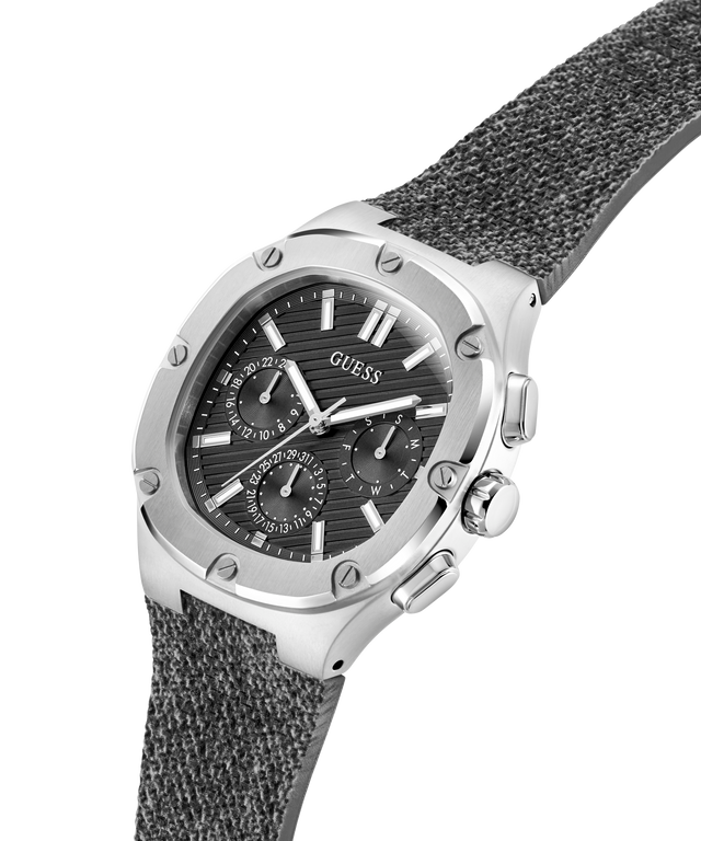 Guess watch with silver case and gray textured strap on a white background lifestyle