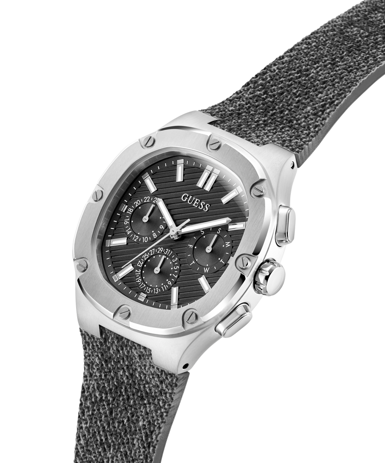 Guess watch with silver case and gray textured strap on a white background lifestyle