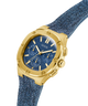 Gold watch with blue fabric strap on a white background lifestyle