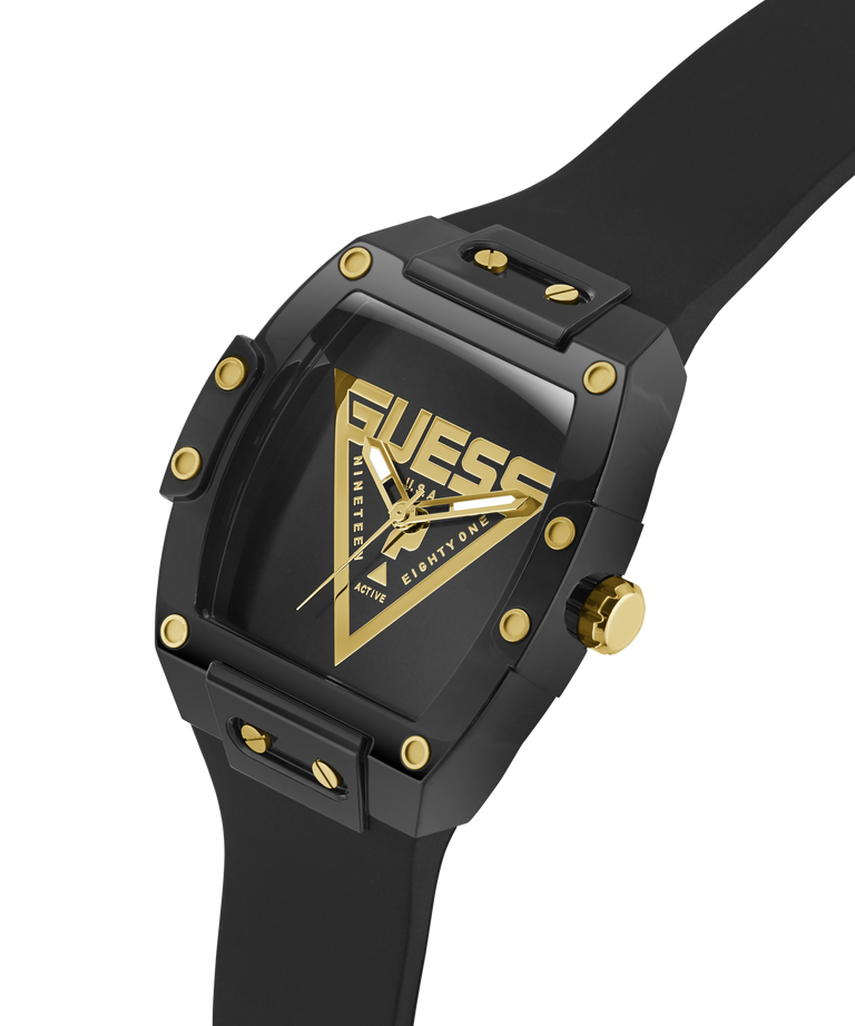 Black and gold Guess watch on a white background lifestyle