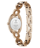 Rose gold Guess women's watch shown from the back, featuring an oval case and a matching rose gold link bracelet with an interlocking link design, on a white background.