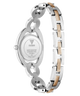 The back view of a GUESS women's stainless steel watch with a two-tone link bracelet, featuring silver and gold-colored links, on a white background.