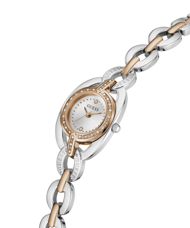 A two-tone stainless steel and yellow gold Guess watch with a white dial and crystal accents, shown on a clean white background. lifestyle