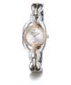 A GUESS women's watch featuring a two-tone silver and rose gold bracelet with rhinestone accents, a silver oval case, and a white dial with gold-tone hands.