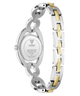 The back view of a GUESS women's stainless steel watch with a two-tone link bracelet, featuring silver and gold-colored links, on a white background.