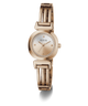 A GUESS women's watch featuring a polished rose gold-tone bangle bracelet, a round bezel accented with clear crystals, and a matching rose gold dial with gold-tone hands.