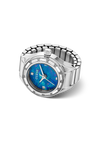A GUESS women's watch ring featuring a silver-tone metal link bracelet, a bezel set with small clear crystals, and a textured blue dial with silver hands and GUESS branding.