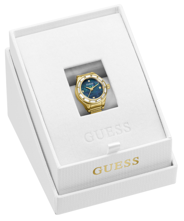 A gold-tone Guess wristwatch ring with a blue dial and blue bezel, presented inside an open white Guess gift box.